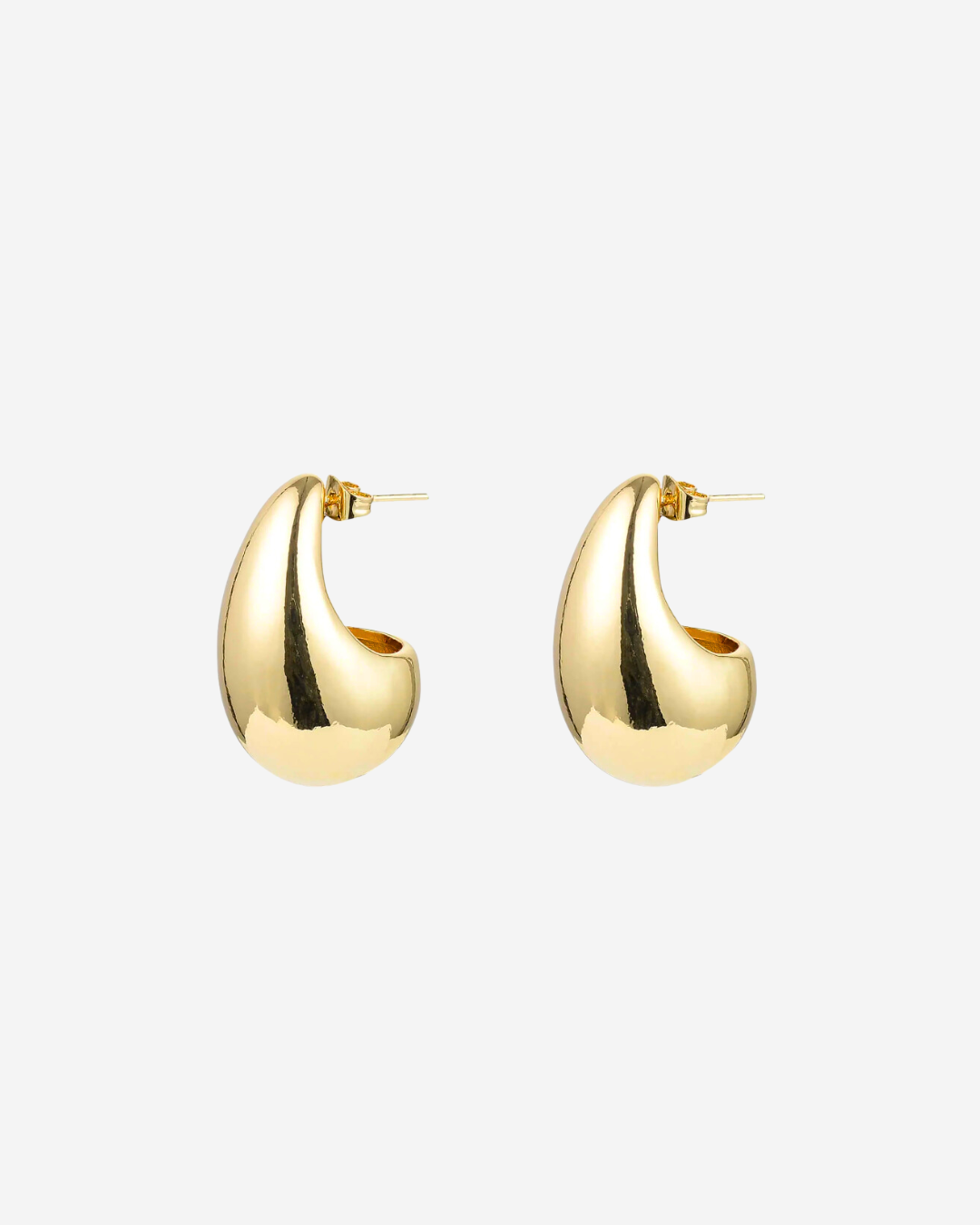 Pair of gold tear dop shaped statement earrings on a white background