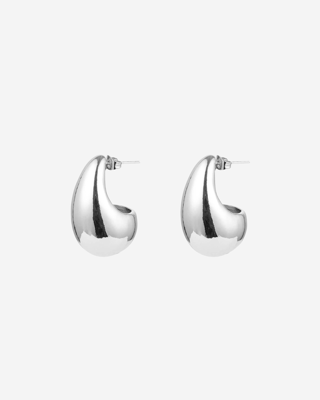 Pair of silver tear dop shaped statement earrings on a white background